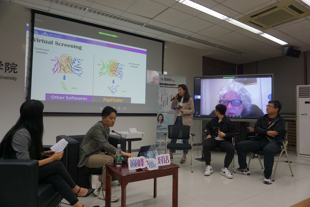 A group of people sitting in chairs in front of a projector screenDescription automatically generated with medium confidence A group of people sitting in chairs in front of a projector screenDescription automatically generated with medium confidence